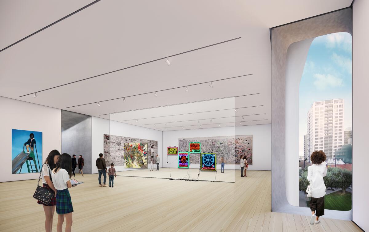     Una vista interior del amplio espacio ampliado muestra a los visitantes y la obra de arte. 